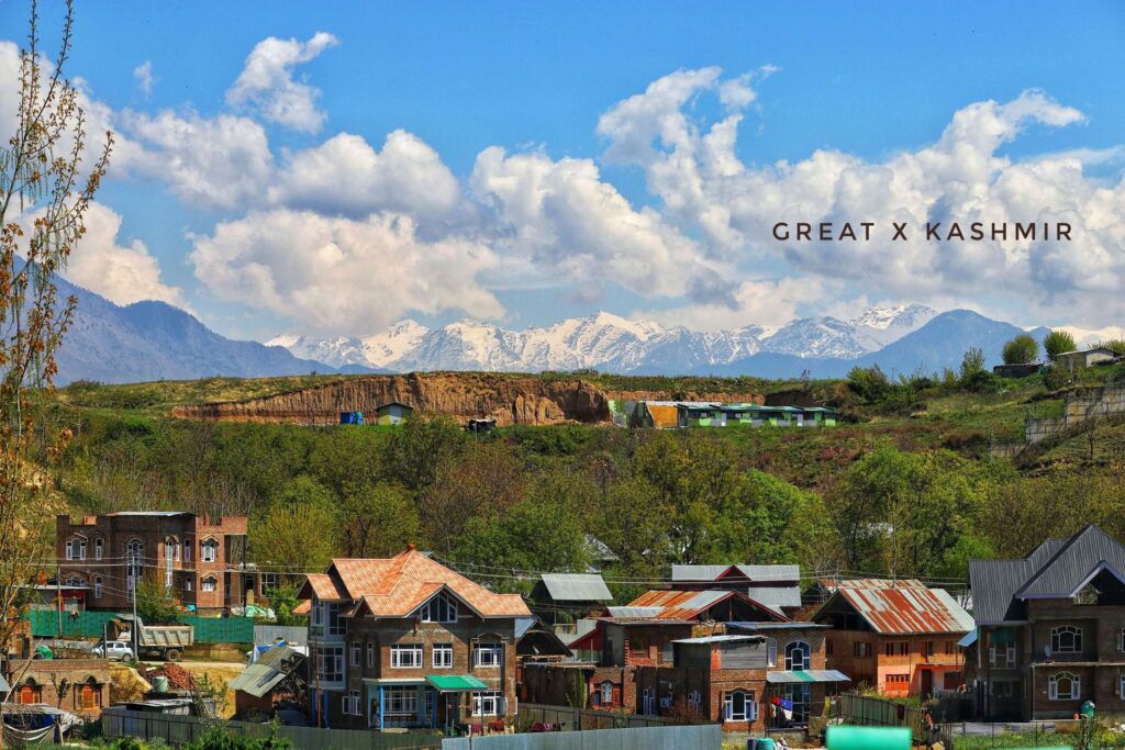 Kashmir Valley village view with snow mountains and blue sky, original photo by Great X Kashmir
